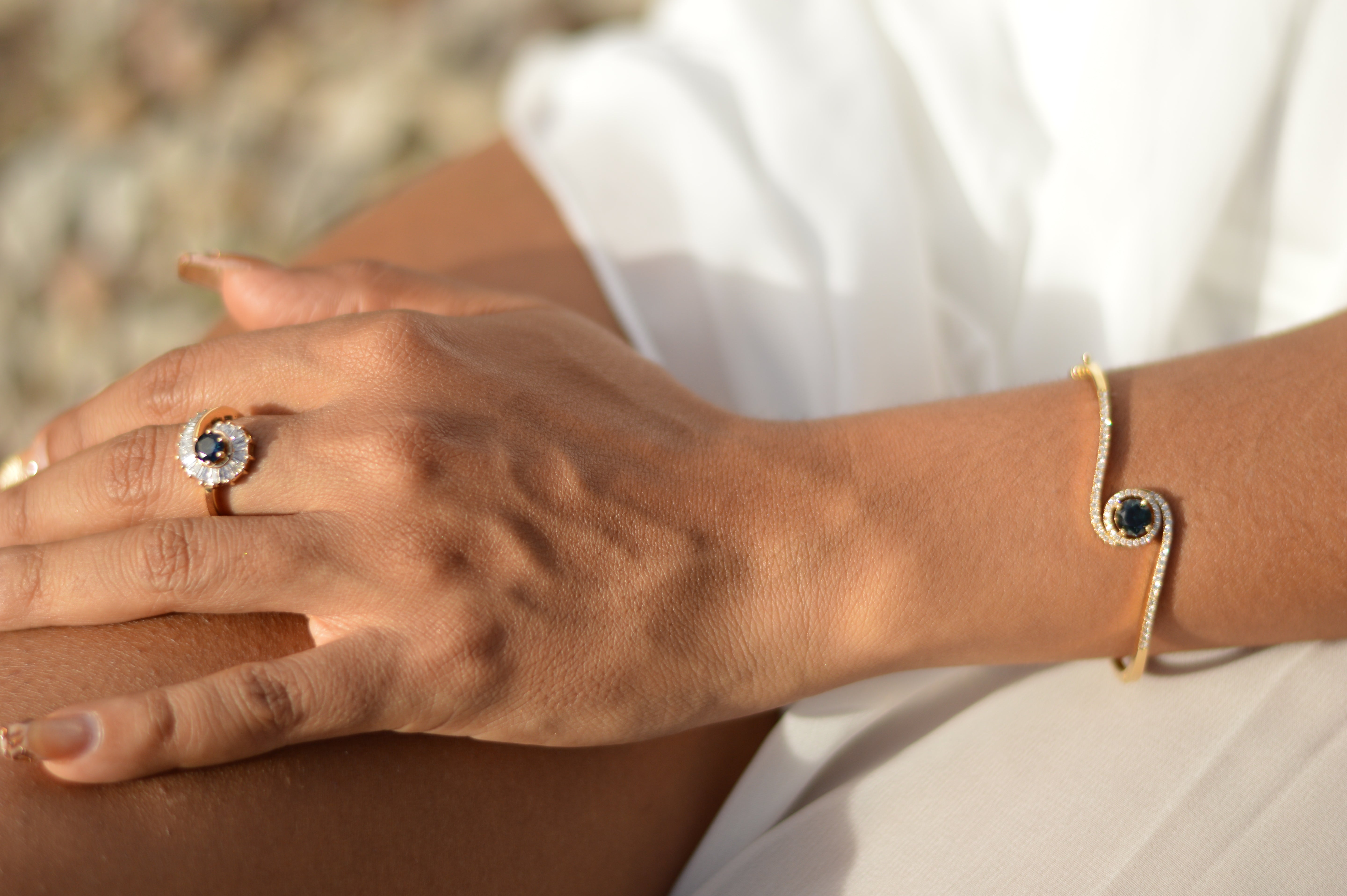 La Gemme Swirl Bangle in your choice of central stone & natural diamonds in 18k yellow gold (customisable).